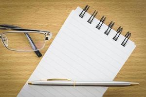 Notepad with blank page photo