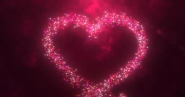 corazón de amor rojo brillante hecho de partículas en un fondo festivo rojo para el día de san valentín foto