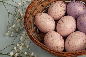 Pastel Easter eggs background. Spring greating card. Easter eggs in basket photo