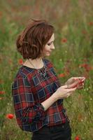 Beautiful woman or business woman talking on a cell phone outside. Outdoor portrait of a beautiful happy businesswoman talking on cell phone. photo