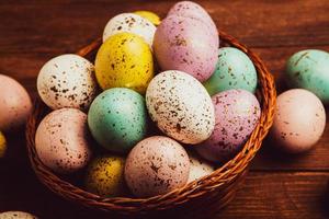 Pastel Easter eggs background. Spring greating card. Easter eggs in basket photo
