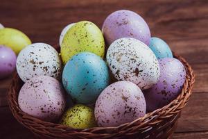 Pastel Easter eggs background. Spring greating card. Easter eggs in basket photo