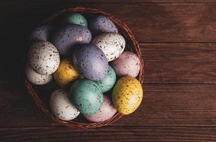 Pastel Easter eggs background. Spring greating card. Easter eggs in basket photo