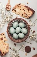 Pastel Easter eggs background. Spring greating card. Easter eggs in basket photo