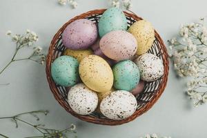Pastel Easter eggs background. Spring greating card. Easter eggs in basket photo