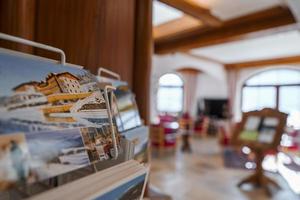 Architecture photographs on stand in lobby of luxury hotel photo