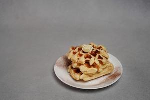 Plate of Homemade Belgian Waffles on Grey concrete Background photo