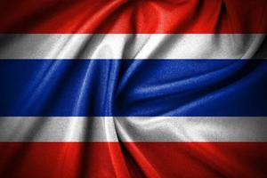 Dark curved of thailand flag made by cotton fabric material, and National Flag of Thailand - Rectangular Shape patriotic symbol photo