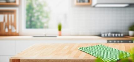 Wood table top on blurred kitchen background. can be used mock up for montage products display or design layout photo