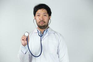 Doctor using stethoscope in hospital photo