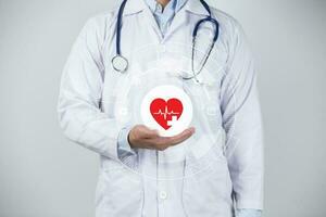 Doctor holding heart photo