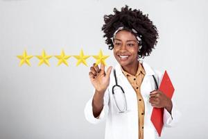 Doctor pushing button key rating increase virtual healthcare in network medicine. Doctor with pointing finger on virtual screen with 5 stars sastisfaction rating and copy space on white background photo