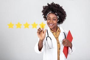 Doctor pushing button key rating increase virtual healthcare in network medicine. Doctor with pointing finger on virtual screen with 5 stars sastisfaction rating and copy space on white background photo