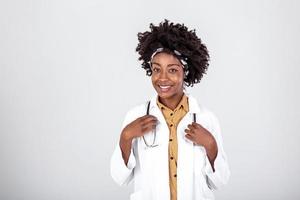 medicine, profession and healthcare concept - smiling african american female doctor or scientist in white coat over grey background photo