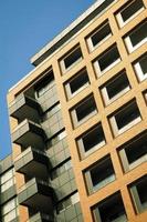 Low angle view of a modern red brick building. photo