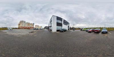 full seamless hdri panorma 360 angle view on parking with cars near buildings provincial town  in equirectangular spherical projection.  VR content photo