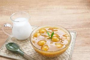 Bubur candil or kolak biji salak, Indonesian traditional food made from sticky rice flour, brown sugar and coconut milk. Popular during ramadan. photo