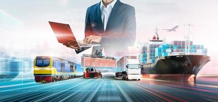 Business and technology digital future of cargo containers logistics transportation import export concept, Engineer using laptop online tracking control delivery distribution on world map background photo