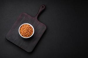 Delicious healthy canned lentils in a ceramic ribbed white bowl photo