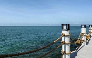 Piers in seaside resorts look luxurious, and suitable for relaxation. Suitable for tourists to enjoy the beauty of the sea. Makes you feel relaxed and calm, just come to relax at the sea during summer photo