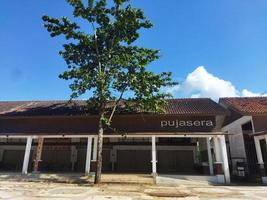 Building with blue sky and clouds photo