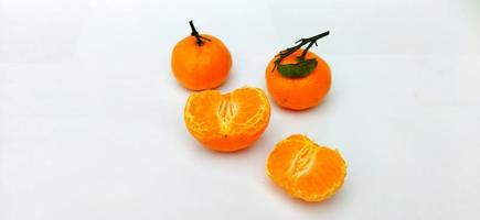 Group of Citrus sinensis, called jeruk baby santang, isolated on white background. Local fresh fruit from Indonesia photo