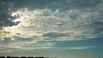 The beautiful sunset sky view with the colorful clouds and warm lights in the sky photo