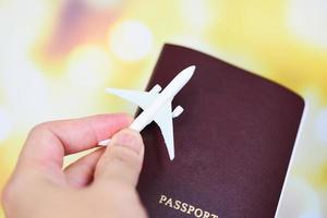 airplane and passport in hand flight travel traveller fly travelling citizenship air boarding pass travel business trip