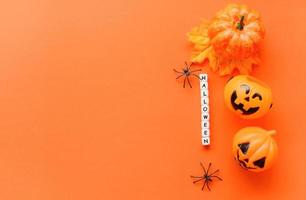 Halloween background orange decorated holidays festive concept spider and jack o lantern pumpkin halloween decorations for party accessories object photo