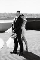 bride and groom first meeting on the roof of skyscraper photo