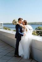 bride and groom first meeting on the roof of skyscraper photo