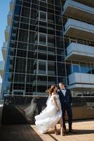 bride and groom first meeting on the roof of skyscraper photo