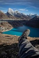 Mountain summit view of small village, mountains and lakes photo