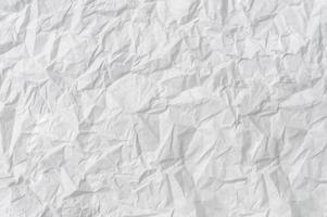Wrinkled or crumpled white stencil paper or tissue after use in toilet or restroom with large copy space used for background texture in decorative art work photo