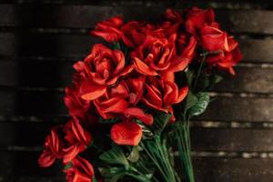 roses on a wooden surface photo