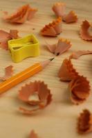 Pencil Sharpener on Wooden Background photo