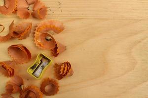 Pencil Sharpener on Wooden Background photo