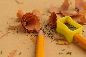 Pencil Sharpener on Wooden Background photo