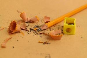 Pencil Sharpener on Wooden Background photo