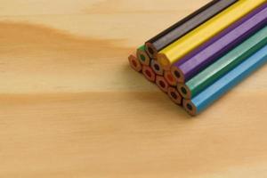 Colored Pencil on Wooden Background photo