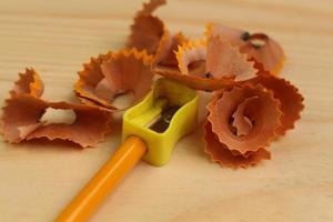 Pencil Sharpener on Wooden Background photo