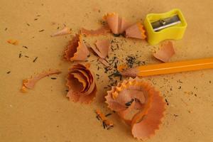 Pencil Sharpener on Wooden Background photo