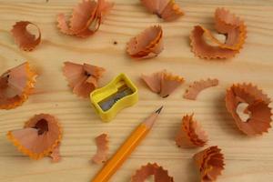 Pencil Sharpener on Wooden Background photo