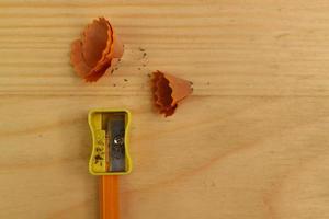 Pencil Sharpener on Wooden Background photo