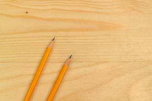 Yellow Pencil on Wooden Background photo