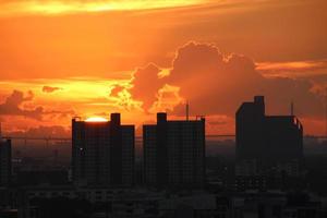 bight golden cloudy sky in sunset background in city building town photo