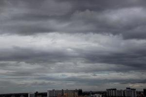 dark blue cloud and white blue sky background and city evening time with rainy cloudy time photo