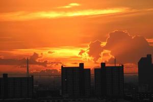 bight golden cloudy sky in sunset background in city building town photo