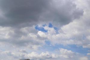 dark blue cloud and white blue sky background and city evening time with rainy cloudy time photo