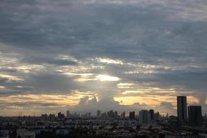 bight golden cloudy sky in sunset background in city building town photo